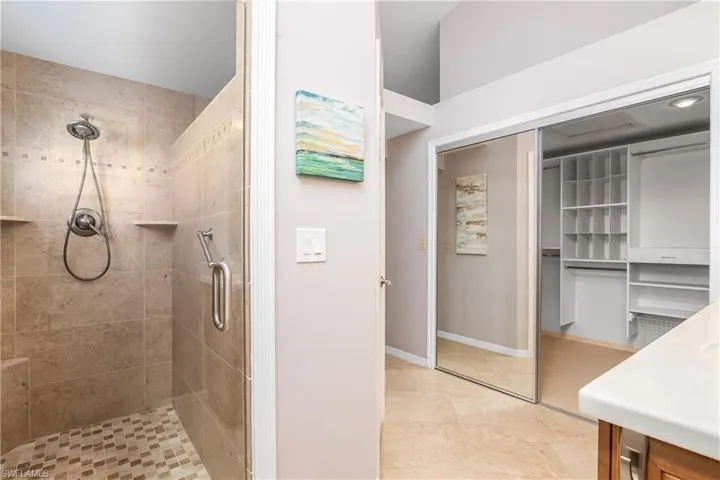 Walk in closet featuring light carpet