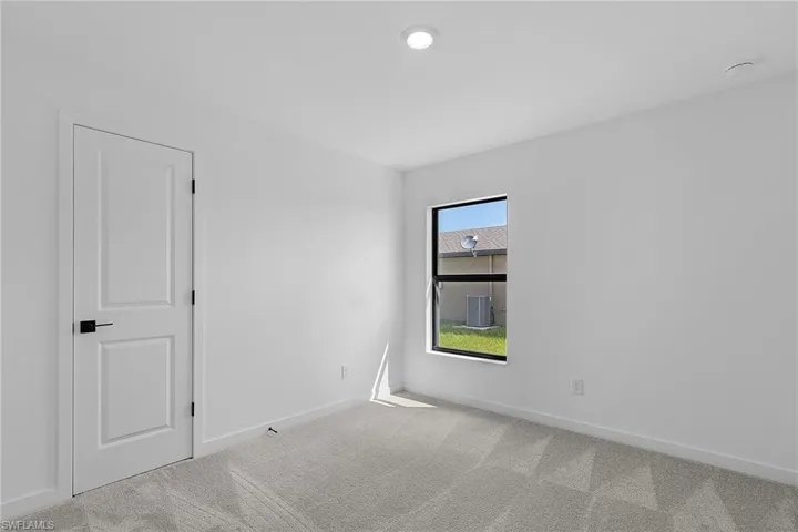 Empty room featuring carpet floors