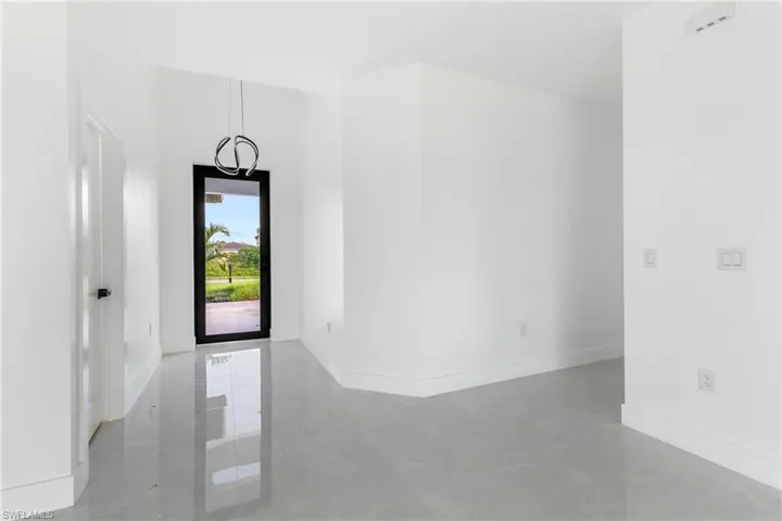 Entrance foyer featuring finished concrete flooring