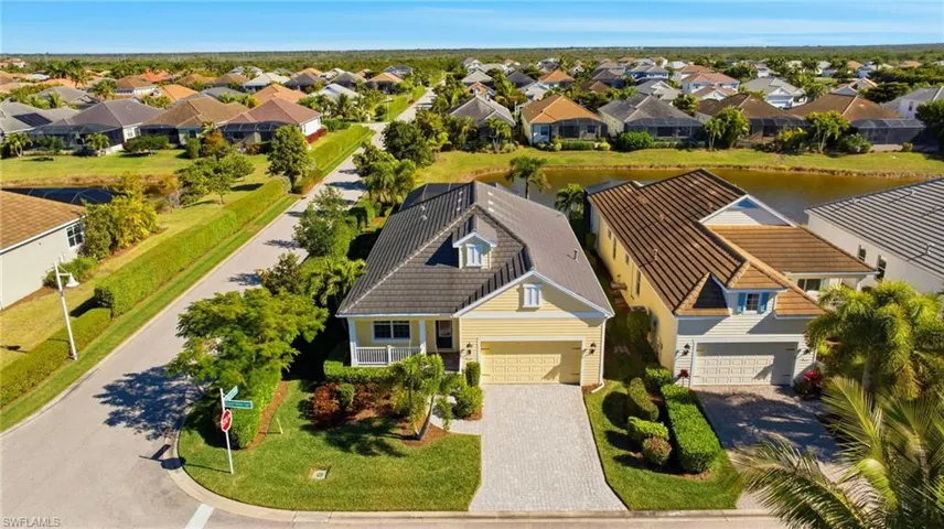 Aerial perspective of suburban area with a large body of water
