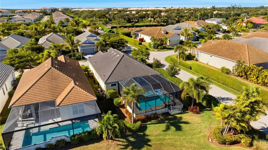 Aerial view of residential area featuring a pool area
