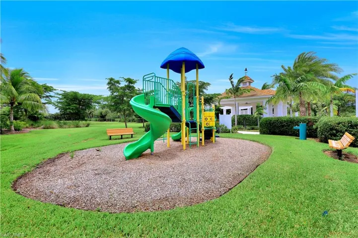 Community jungle gym with a yard