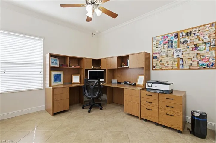 Office space featuring crown molding and a ceiling fan