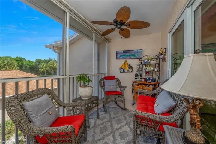 Sunroom / solarium with ceiling fan and plenty of natural light