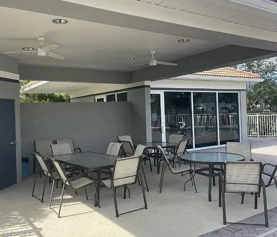 Pool Area Covered patio area with recessed lighting and ceiling fans