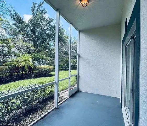 Screened patio with a painted concrete floor, recessed ceiling light, and sliding glass door