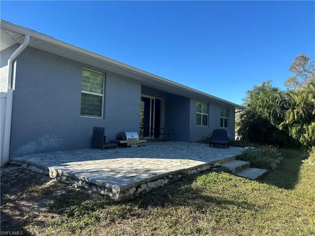 Rear view of property featuring a patio