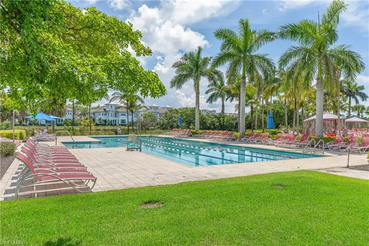 Community pool with a lawn and a patio area