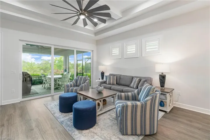 Living room with baseboards and wood finished floors