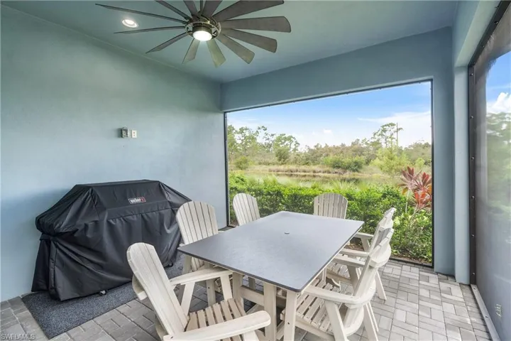 Sunroom with view of wooded area