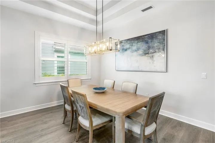 Dining room featuring baseboards and wood finished floors