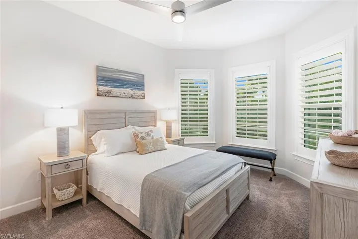 Bedroom featuring carpet and a ceiling fan