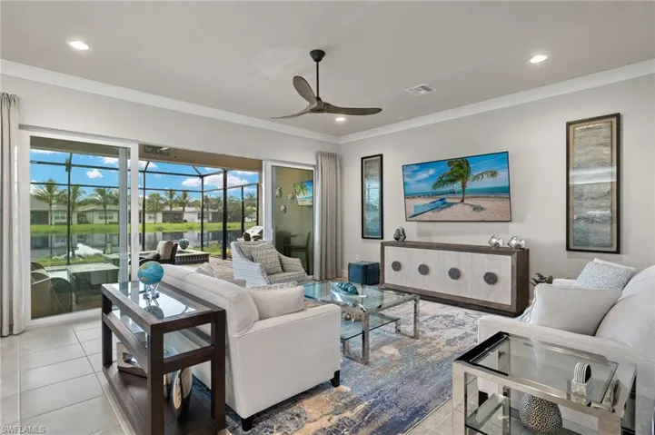 Dramatic views abound from your Living room with high ceilings and triple slider.