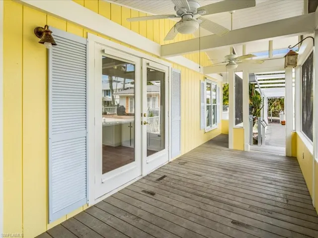 Wooden deck featuring ceiling fan
