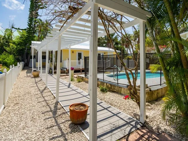 View of pool featuring a pergola and a patio area