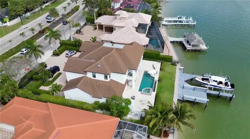 Birds eye view of property featuring a water view
