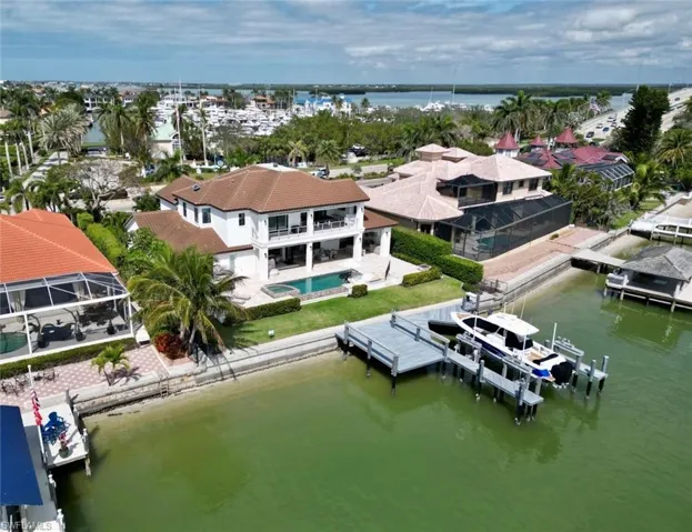 Birds eye view of property featuring a water view