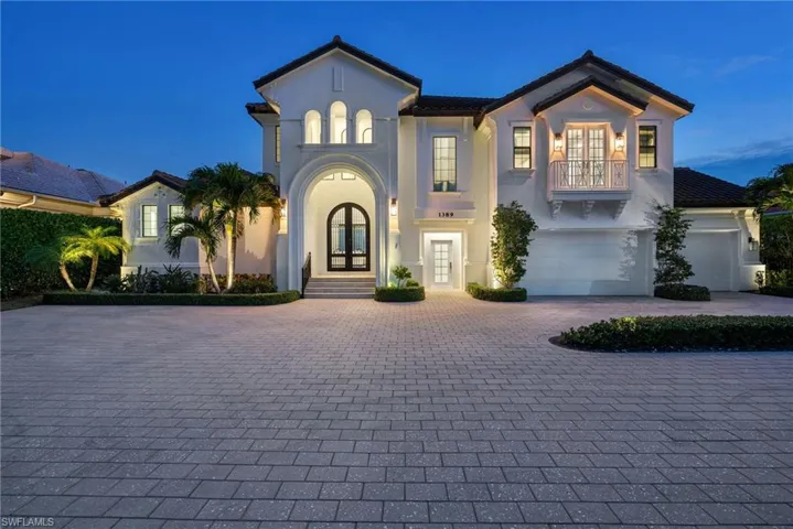 Mediterranean / spanish house featuring french doors, a balcony, and a garage