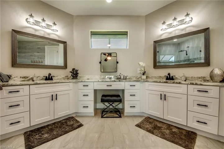 Two Complete areas for him and her with Double Sinks, 13 Drawers, and Makeup area