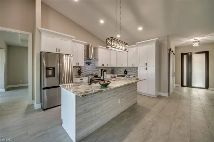 Kitchen with Shiplap on front of island.