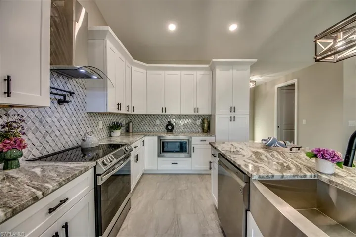 Under counter Microwave is straight ahead, 3 shelf Dishwasher with low Decibel for quiet operation, Stainless Farmer Sink, Convection Oven, Pot Filler , Large Pantry to the right