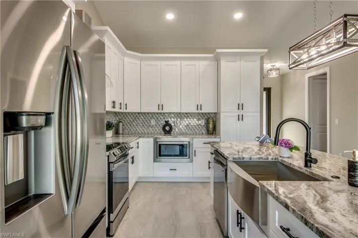 Kitchen with all the bells and whistles and don't forget the shiplap on the front of the large island