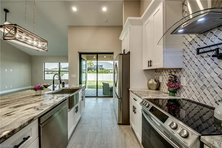 Look at that view out of the sliding glass doors off the kitchen.  Did I mention that they pocket all the open ?