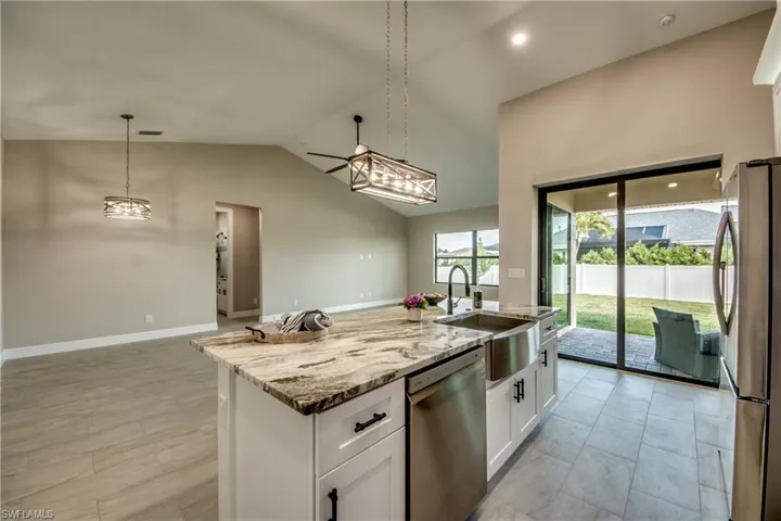 Kitchen is open to Greatroom with Sliders going to Lanai