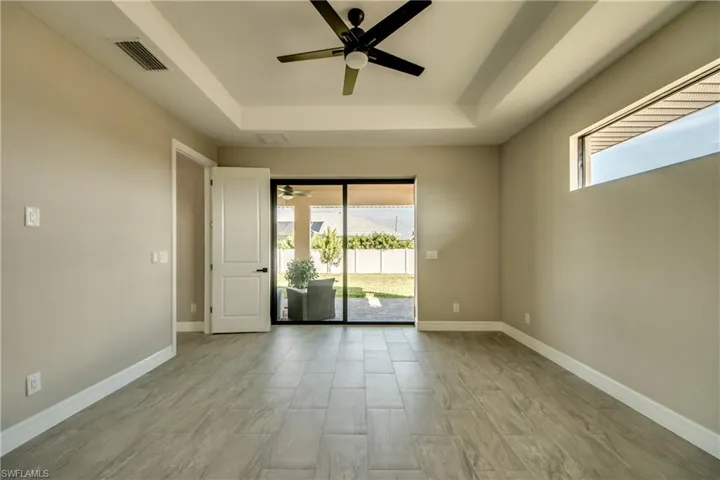 Transon Window, Trey Ceiling, 8 ft door, Sliders that Pocket in large Master