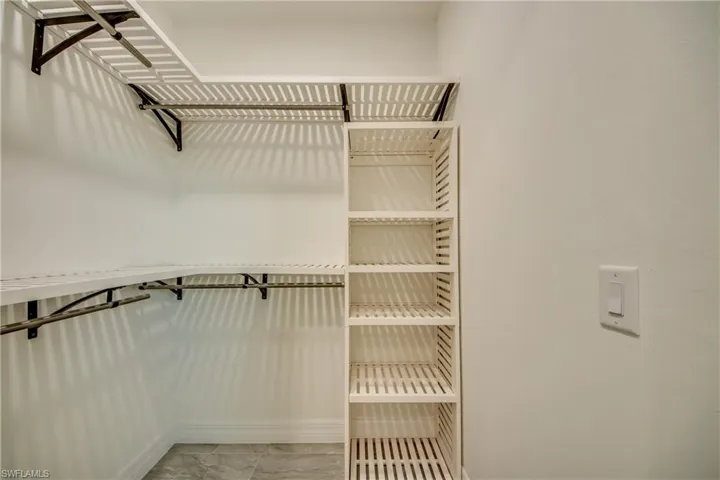 Master Walk in Closets for him and her with Custom Wooden Shelves
