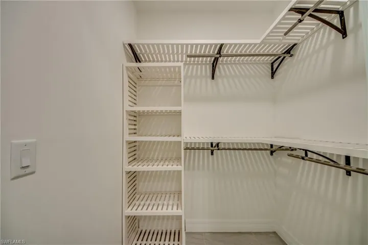Master Walk in Closets for him and her with Custom Wooden Shelves