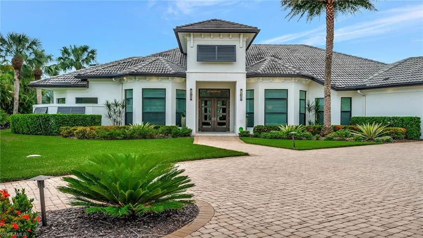 Exterior with circular driveway and two car garage