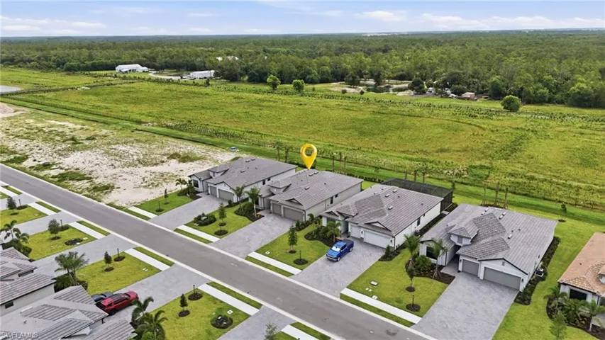 Aerial perspective showcasing a residential street with uniform contemporary homes