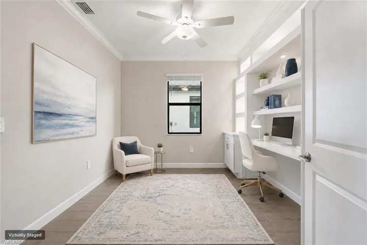 Integrated built-in desk and shelving unit featuring recessed lighting
