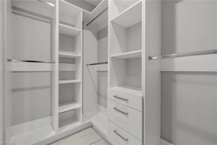 Walk in closet featuring light tile patterned floors