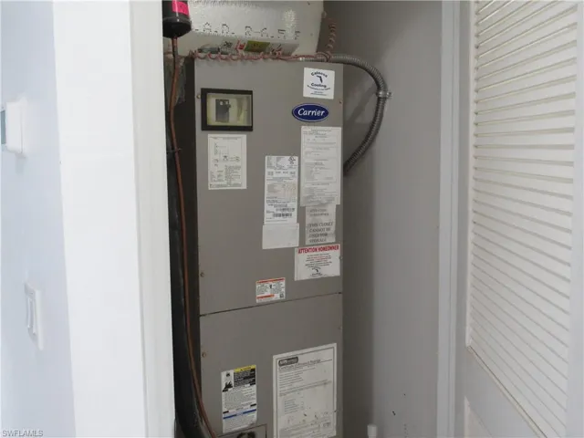 Utility room featuring heating unit