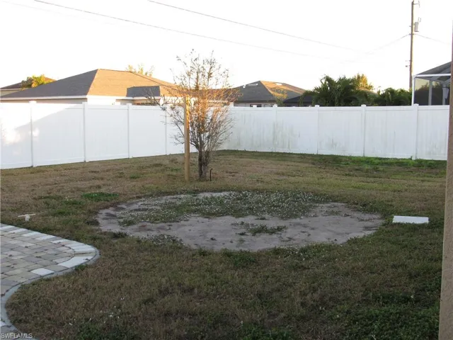 View of fenced backyard