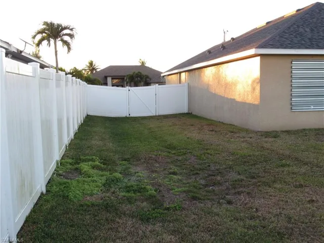 Fenced backyard with a gate