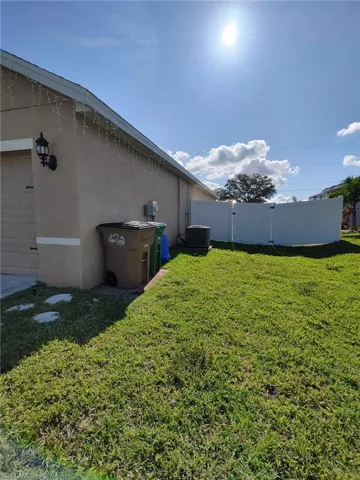 View of yard featuring a gate