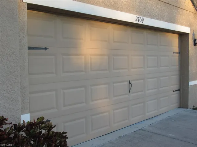 Garage featuring driveway