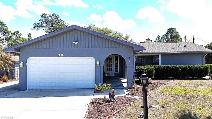 Ranch-style house featuring driveway, a porch, a garage, stucco siding, and roof with shingles