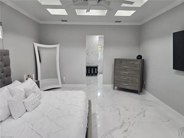 Bedroom featuring crown molding and ceiling fan