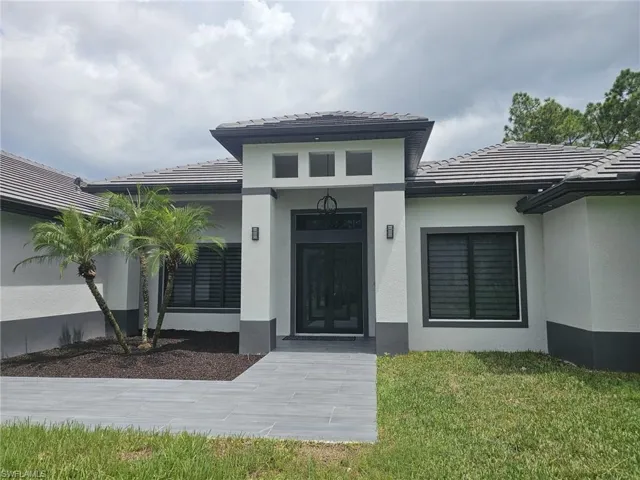 Property entrance with a lawn