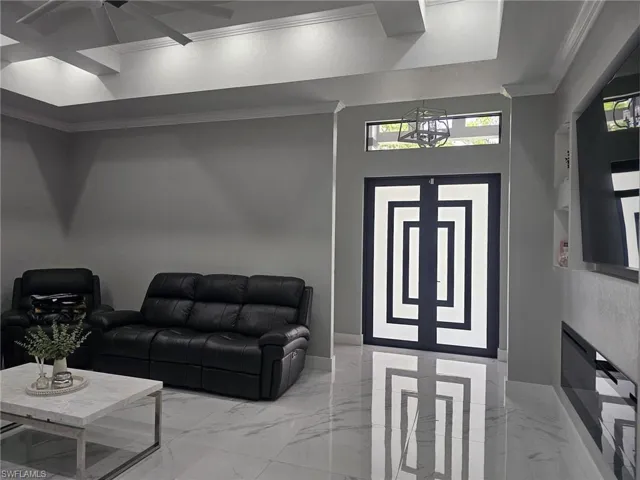 Foyer featuring crown molding