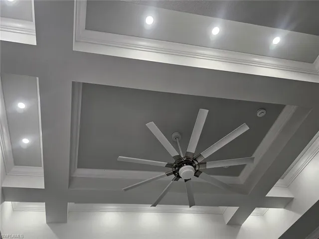 Interior details featuring coffered ceiling and ceiling fan