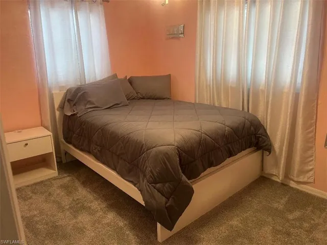 Bedroom with carpet flooring