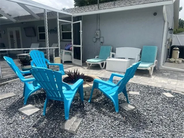 View of patio featuring glass enclosure