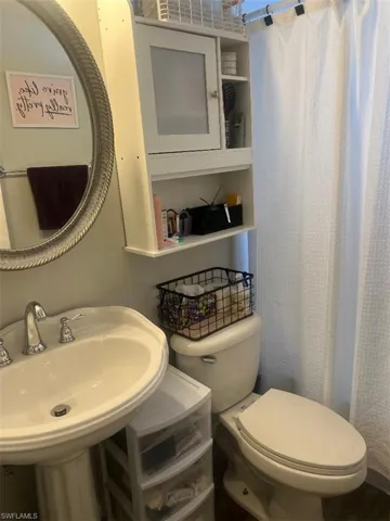 Bathroom featuring sink and toilet
