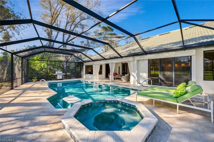 Spa and pool area looking back at the well maintained home