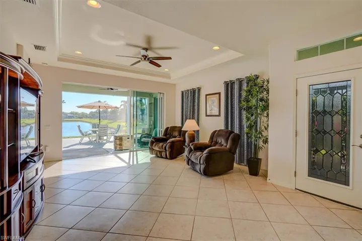 Living room, recessed lighting, and a tray ceiling